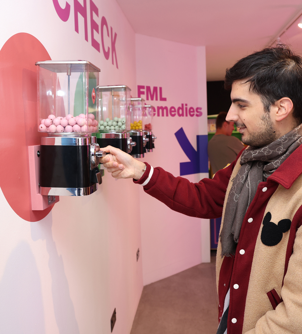 Photograph of a man interacting inside the FML store